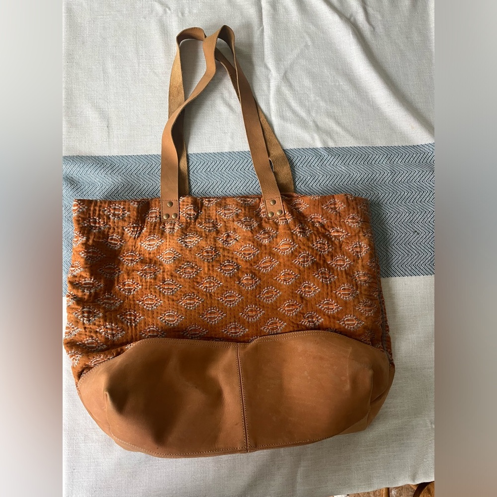 Beautiful quilted burnt orange colored tote with Suede bottom and straps